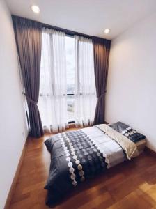 a bedroom with a bed and a large window at [PROMO]Connected train 2 Bedrooms - Above Mall(25) in Kuala Lumpur