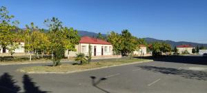 an empty street in a town with a building at Arena Hotel Balakan in Balakǝn