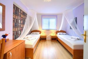 Postel nebo postele na pokoji v ubytování Apartman BOR Krk