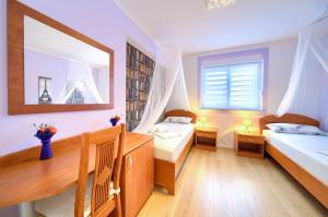 Postel nebo postele na pokoji v ubytování Apartman BOR Krk