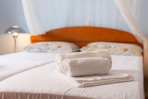 Postel nebo postele na pokoji v ubytování Apartman BOR Krk
