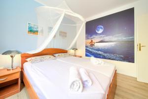 Postel nebo postele na pokoji v ubytování Apartman BOR Krk
