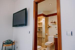 Kúpeľňa v ubytovaní Acogedor adosado con piscina