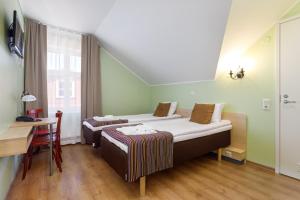 Postel nebo postele na pokoji v ubytování Koidulapark Hotell + 16 fotografií