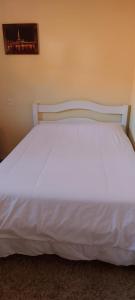 Cama o camas de una habitación en Kit net de Temporada em Gramado