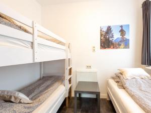 Łóżko lub łóżka w pokoju w obiekcie Apartment in Bichlbach near Ski Slopes