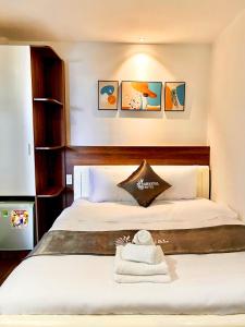 Postel nebo postele na pokoji v ubytování Carnival Hotel - Đà Lạt