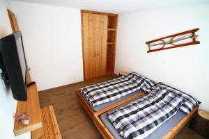 Postel nebo postele na pokoji v ubytování Amor Lodge