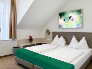 Postel nebo postele na pokoji v ubytování Hotel Lokomotive