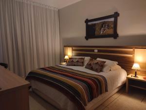 Cama ou camas em um quarto em Cambará Eco Hotel