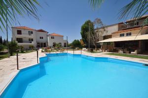 
a large swimming pool in a residential home at Actor Hotel in Ligourio
