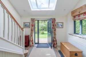 a house with a skylight and a hallway at Barn End in Chipping Campden