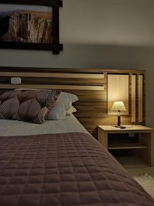 Cama ou camas em um quarto em Cambará Eco Hotel