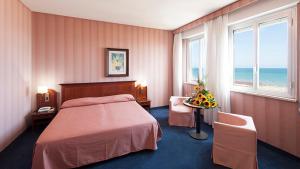 Postel nebo postele na pokoji v ubytování Hotel Esplanade