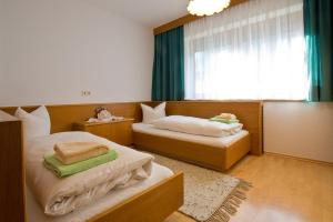 Postel nebo postele na pokoji v ubytování Apart Auer Umhausen