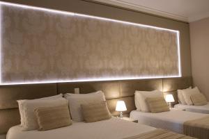 Postel nebo postele na pokoji v ubytování Hotel Pousada Kaster