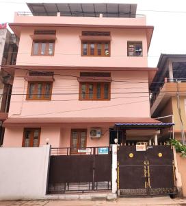 a house with a gate in front of it at Saanvi Homestay in Guwahati