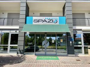 a building with a sign on the front of it at Hotel Spazio Residenza in Pescara
