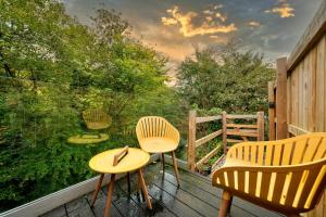 two chairs and a table on a deck with a view at Finest Retreats - Luxurious Hidden Cragg Vale Escape by Hebden Beck in Hebden Bridge