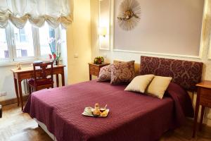 Postel nebo postele na pokoji v ubytování Domus Cavour Guest house