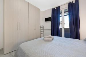 En eller flere senge i et værelse på Cà de Anto