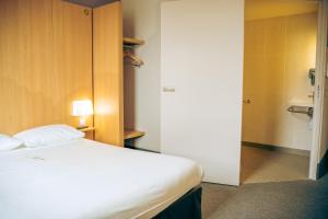 Postel nebo postele na pokoji v ubytování B&B HOTEL Metz Est Technopole Pôle Santé