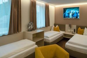 Postel nebo postele na pokoji v ubytování Hotel Lokomotive