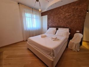 En eller flere senger på et rom på Casa di Anna a Perugia