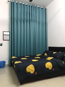 a bedroom with a bed with yellow cats on it at MMG D'Bertam Homestay For Malay Only in Kampong Permatang Durian