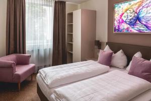 Postel nebo postele na pokoji v ubytování Hotel Lokomotive