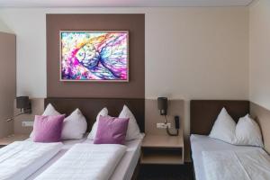 Postel nebo postele na pokoji v ubytování Hotel Lokomotive