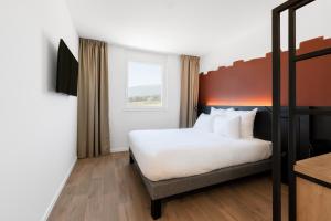 B&B HOTEL Geneva Airport客房内的一张或多张床位