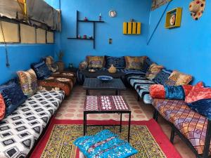 a living room with couches and a table at Hostel Kech Vibe in Marrakech