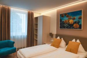 Postel nebo postele na pokoji v ubytování Hotel Lokomotive
