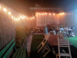 a patio with chairs and a table and a fence at Al Vicoletto in Taranto