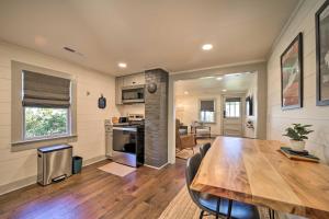 a kitchen and dining room with a wooden table and chairs at Updated Brevard Home - Close to Downtown! in Brevard