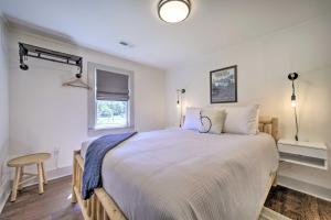 a bedroom with a large bed and a desk at Updated Brevard Home - Close to Downtown! in Brevard