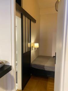 Postel nebo postele na pokoji v ubytování Le Carré Carnot Annecy