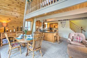 a dining room and kitchen with a table and chairs at Château Forêt with Hiking Trail Access Nearby in Big Bear City