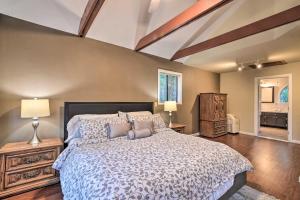a bedroom with a large bed with pillows at Deck + Grill: Mtn Haven in Stanislaus Nat'l Forest in Arnold