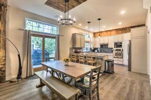 a kitchen with a wooden table and a dining room at Tahoe City Getaway about 1 Mi to Commons Beach! in Tahoe City