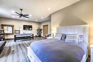 a bedroom with a large bed with a ceiling fan at Tahoe City Getaway about 1 Mi to Commons Beach! in Tahoe City