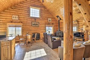 a log cabin with a dining room and living room at 22STR-00360 Fairplay Cabin with Fire Pit, Mtn Views! in Fairplay