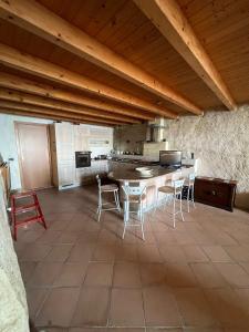 a kitchen with a table and chairs in a room at Admirari in Tropea