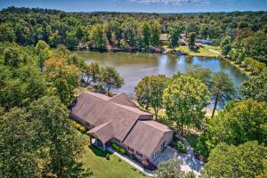an overhead view of a large house on a lake at Spacious Group-Friendly Georgia Home on Lake in Trenton