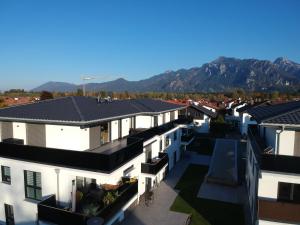 arial view of a row of houses with mountains in the background at Panorama Penthouse in Füssen