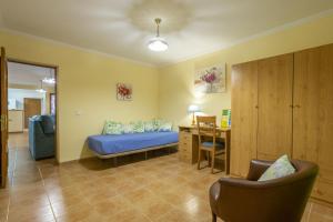 Postel nebo postele na pokoji v ubytování Finca Can Tomeu