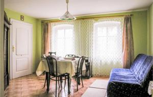 a dining room with a table and chairs at Beautiful Home In Cekcyn With 2 Bedrooms in Cekcyn