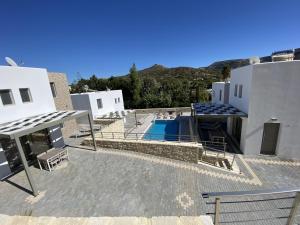 a view from the roof of a house with a swimming pool at Matala Prime Villas in Matala