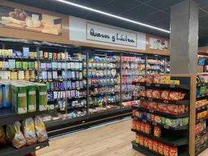 a grocery store aisle with a lot of products at Tropical Paradise in Tarajalejo